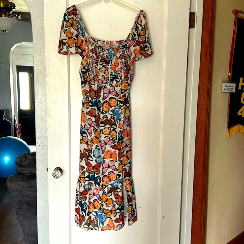 Beautiful Show Me Your MuMu dress with Tags! Size Large. Has butterfly pattern